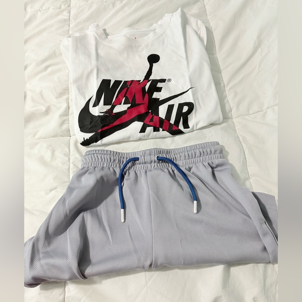 Jordan White T-Shirt with Red Logo set for boys.
Shirt is nwot.